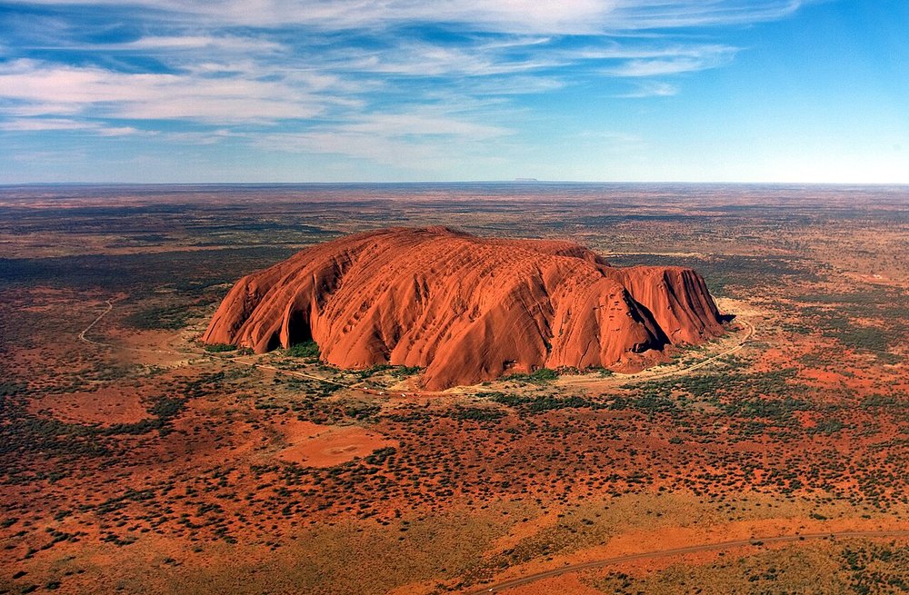 Aerial shot of the great red rock of Uluru