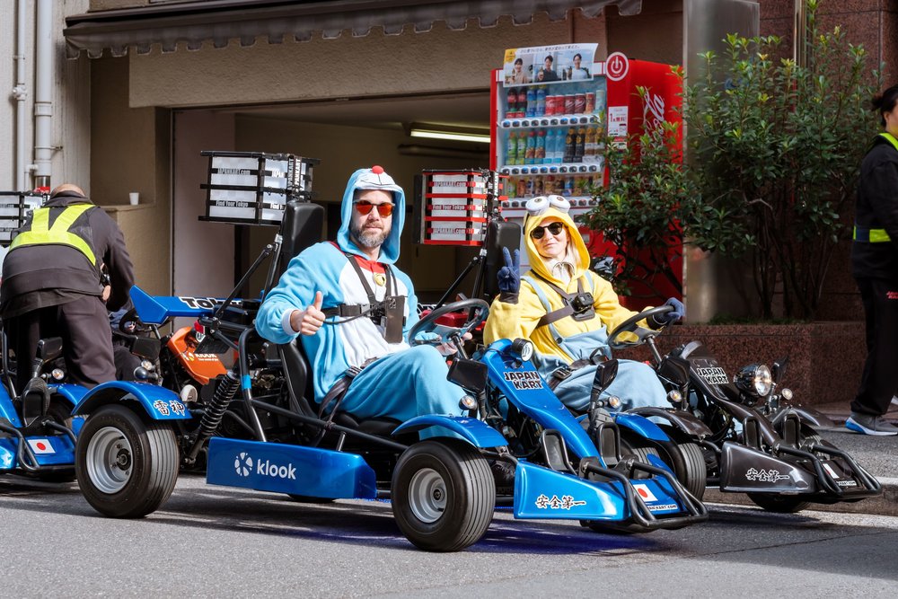 Tourists enjoy go-karting through the streets of Tokyo