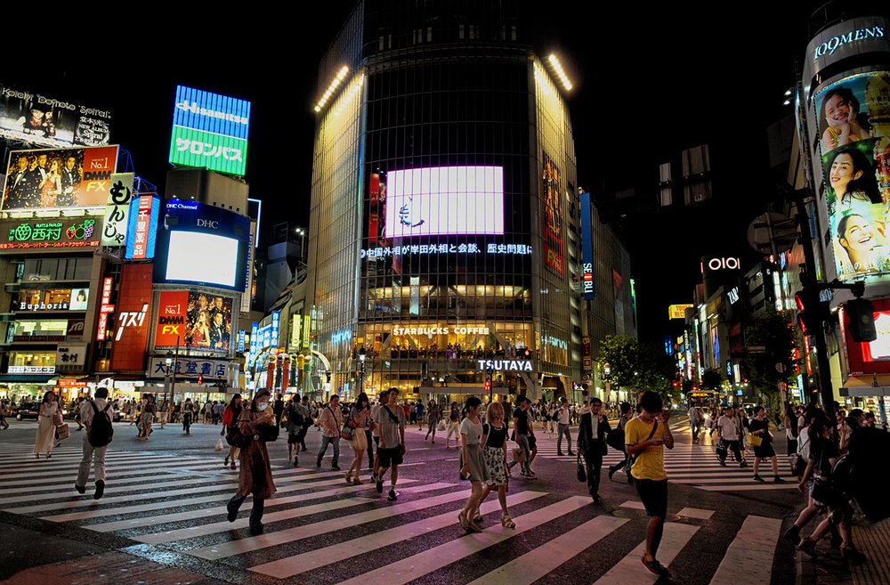 Nighttime energy at Shibuya Crossing in Tokyo