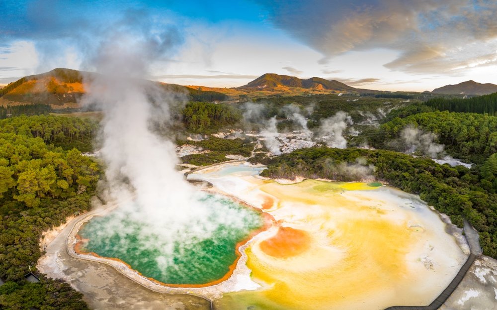 Vibrant geothermal pools steaming in Wai-O-Tapu near Rotorua