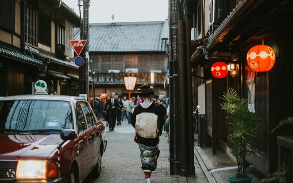 Red taxi along the historic Gion district in Kyoto