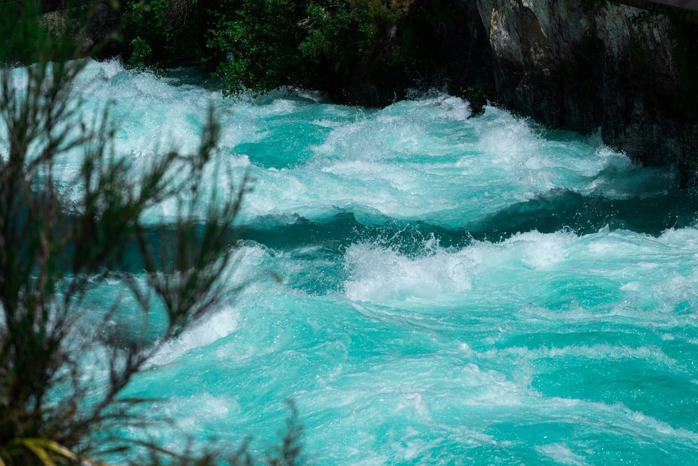 The base of Huka Falls, which resembles foaming waters.