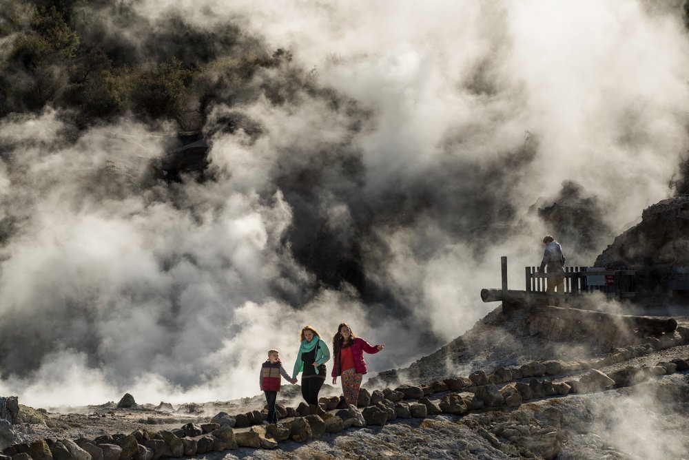 A group of people exploring Hell’s Gate in Rotorua.
