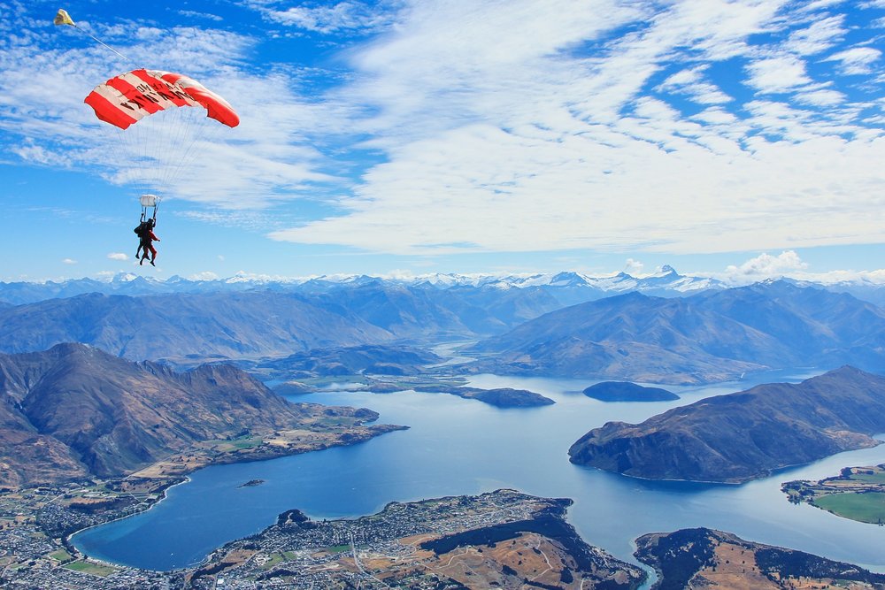 Two people paragliding over Lake Wanaka.