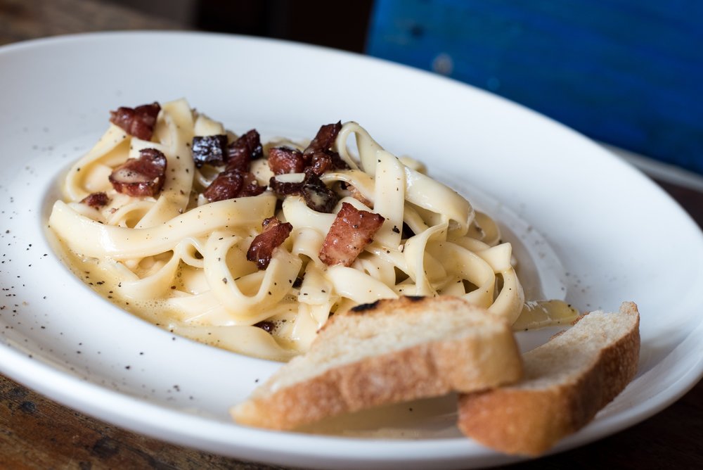 Classic carbonara with guanciale, bacon, and bread