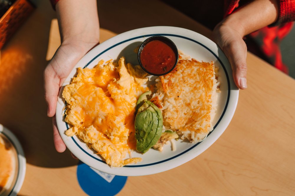 Hash brown scramble with eggs and avocado