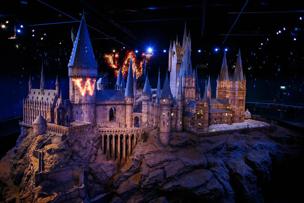 The iconic Hogwarts Castle model is illuminated inside Warner Bros. Studio Tour London
