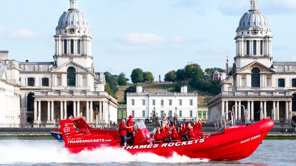 A Thames Rockets speedboat races past the Old Royal Naval College in Greenwich, London