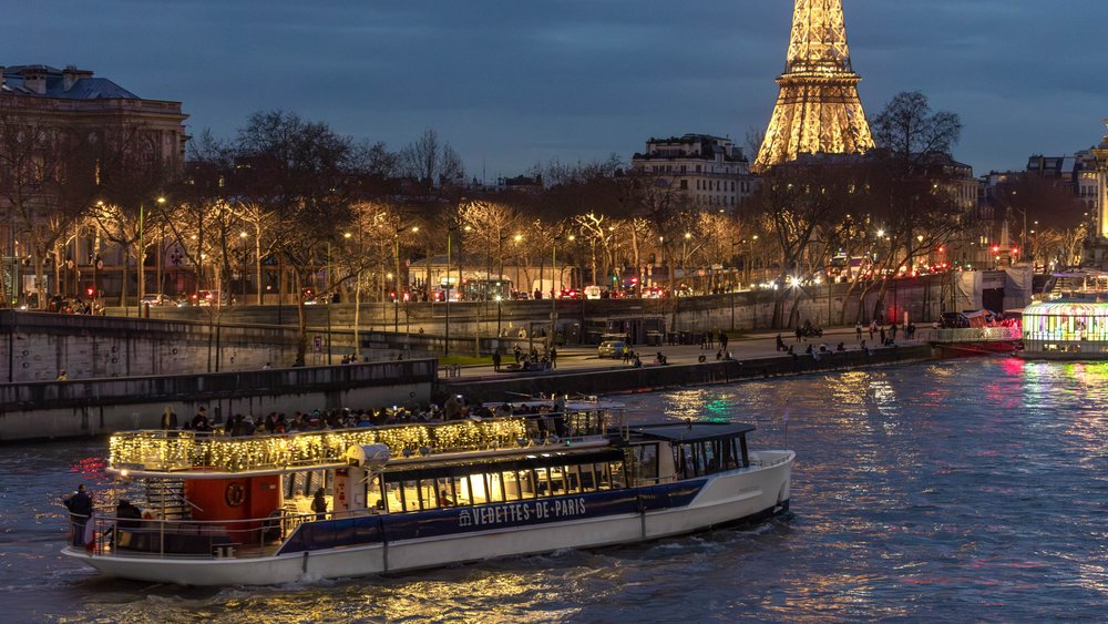 Hop on the Seine River cruise at night and see the Eiffel Tower lit up