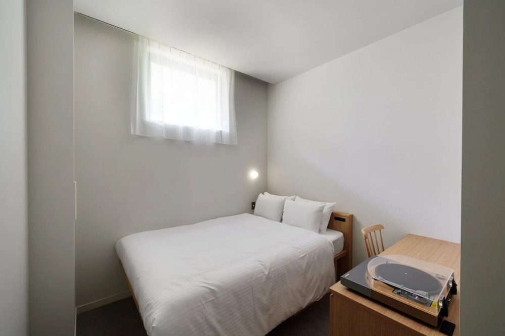 A room in Mustard Hotel, with a vinyl record player