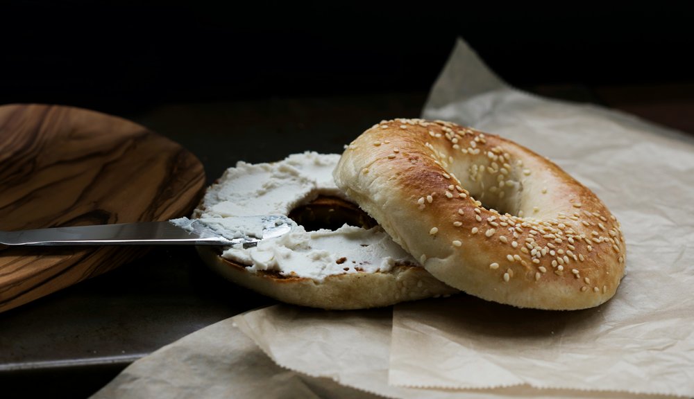 Bagel with cream cheese | Photo by Caroline Ross on Unsplash 