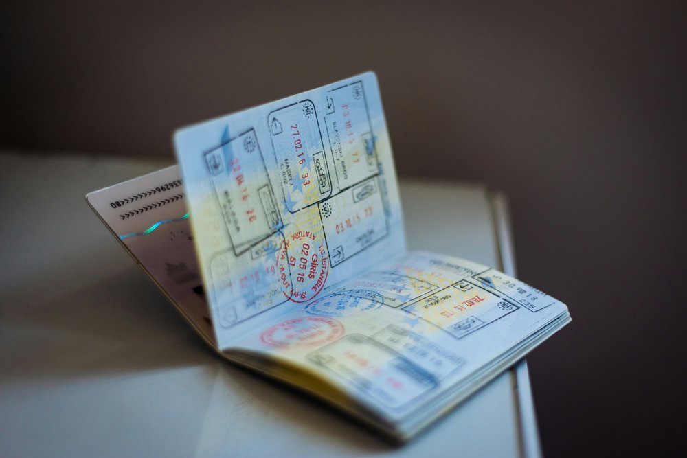  Passport full of travel stamps | Photo Credit: Global Residence Index on Unsplash