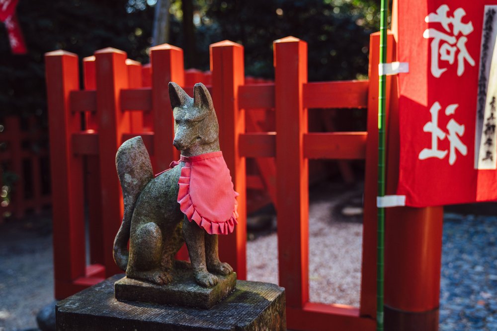 Traditional fox statue at Fushimi Inari Shrine