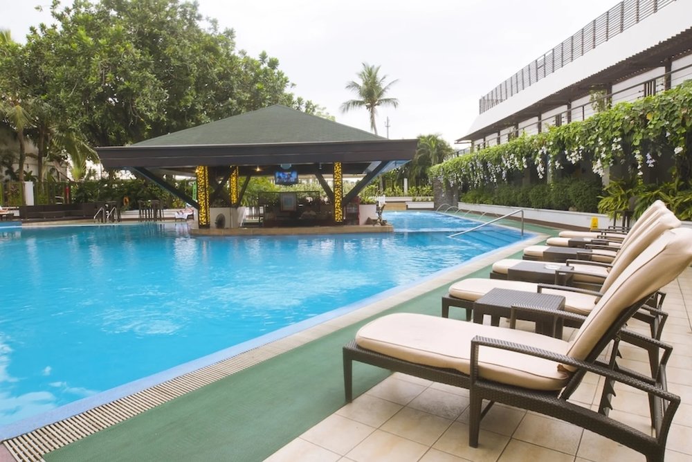 Outdoor swimming pool at The Manila Bay Hotel