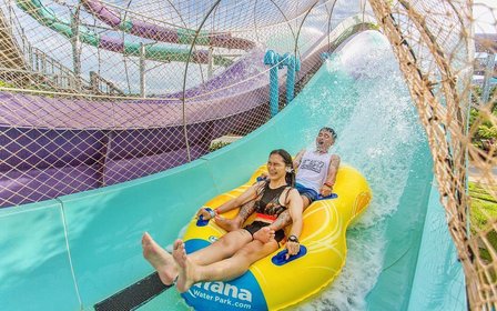 Drift along a lazy river with active waterfalls or plunge down the famous AquaDrop slide