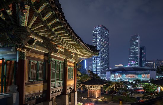 Bongeunsa Temple and view of Gangnam in Seoul, South Korea at night