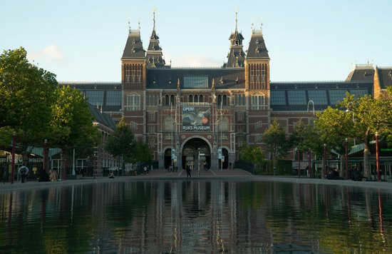 Walk along the tree-lined exterior leading to the Rijksmuseum