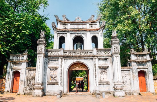Front view of Temple of Literature entrance with trees and clear sky