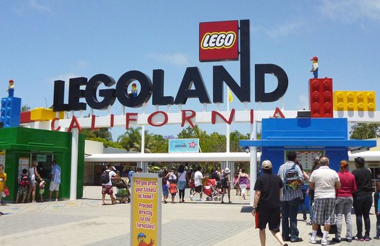 Tourists walking through the main entrance of LEGOLAND California.