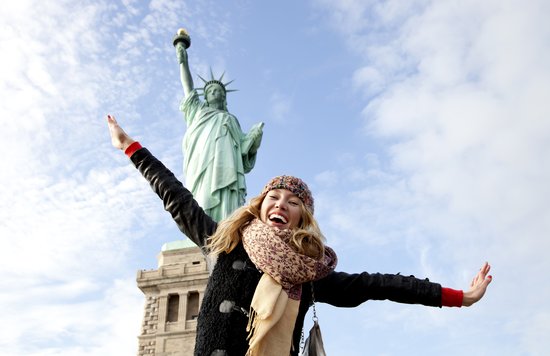 Striking a pose with the iconic Statue of Liberty