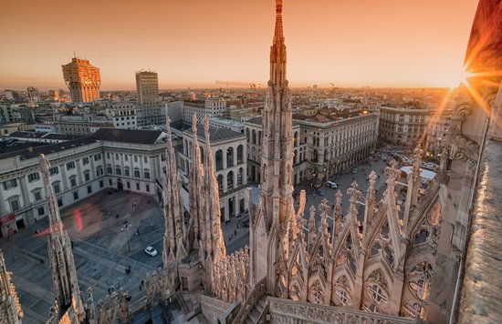 View from the Duomo rooftop overlooking Milan city center at sunset