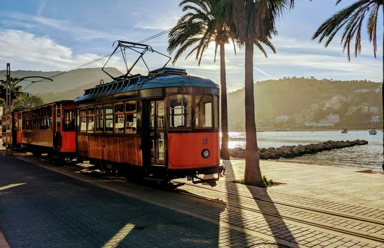  Scenic commuter train traveling along a coastal route in Spain | Photo Credit: Wojciech Then on Unsplash