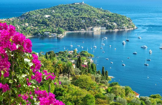 French Riviera coastline with clear blue water and boats