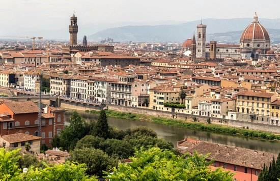 Aerial view of Florence with the Duomo, Palazzo Vecchio, and Arno River