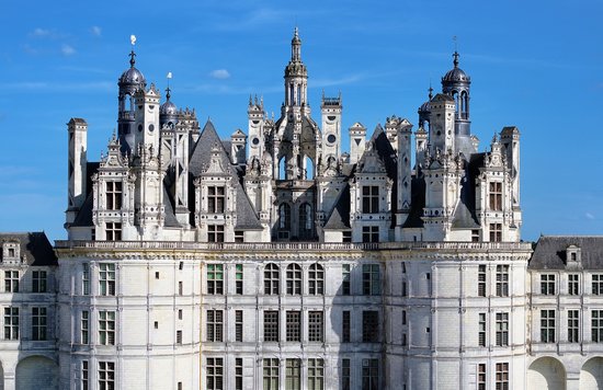 Grand Loire Valley castle facade with detailed towers and arches