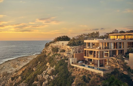 Stunning sunset view of Six Senses Ibiza perched on the rocky coastline