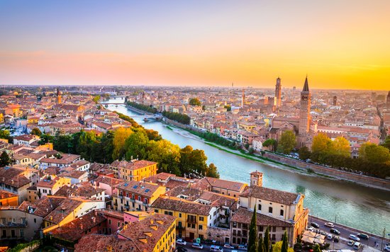 Scenic panorama of Verona, Italy, featuring the Adige River and iconic buildings