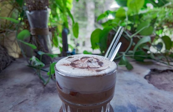 Coffee on a balcony with plants