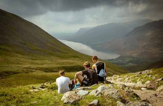 Hikers overlooking from Scafell Pike in the UK