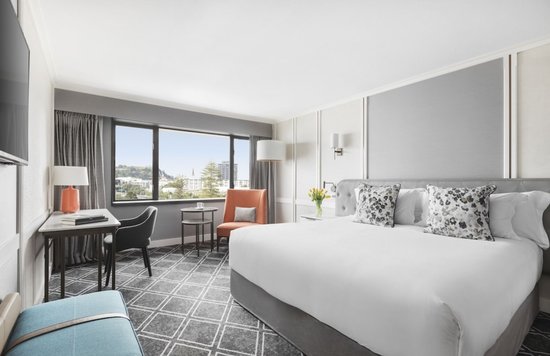 Elegant guest room at Cordis Auckland with city views and modern amenities