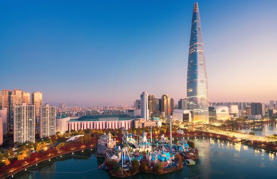 Lotte World Tower skyline view in Seoul at sunset with cityscape and lake