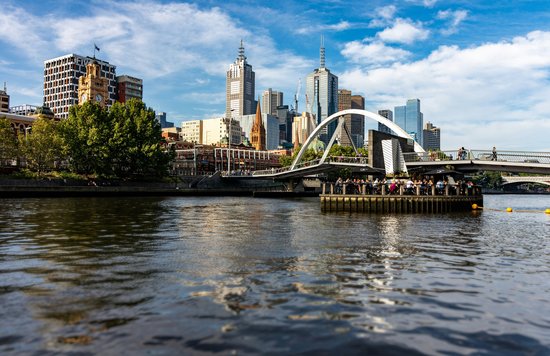 A group of people on a cruise along the Yarra River.