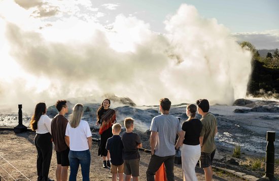 Visitors watching steam rise at Te Puia Rotorua