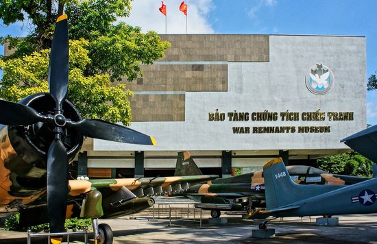 Exterior of the War Remnants Museum in Ho Chi Minh City with aircraft displayed in front