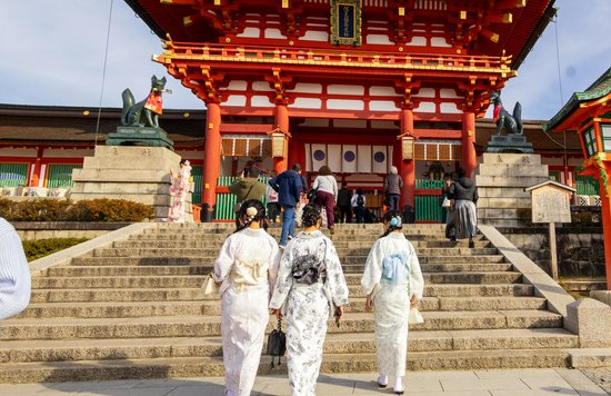 Visitors in kimono enter Kyoto’s Fushimi Inari Shrine | Photo Credit: Emiliano Lara on Pexels