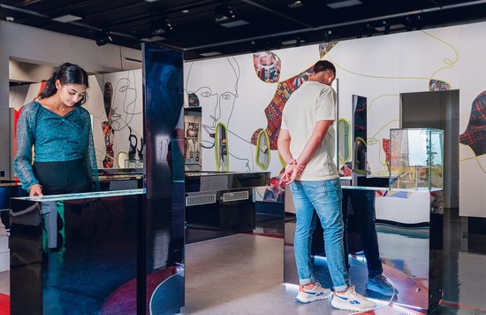 Visitors explore contemporary exhibits in Immigration Museum