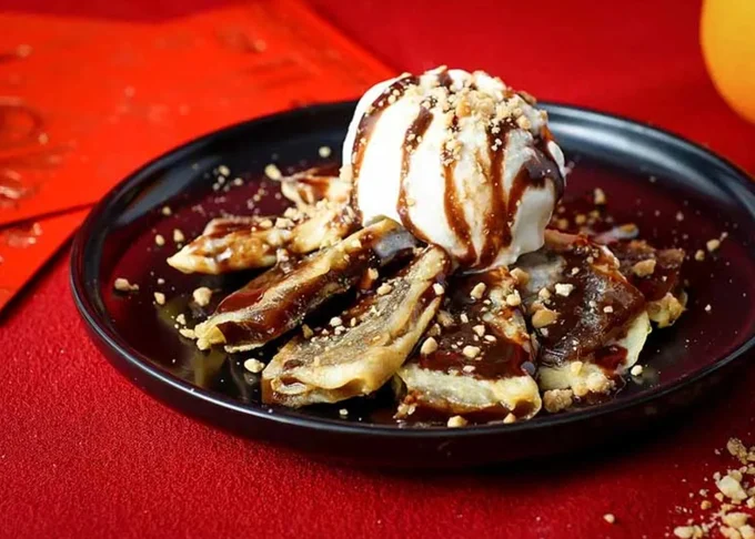 tikoy topped with ice cream and chocolate sauce