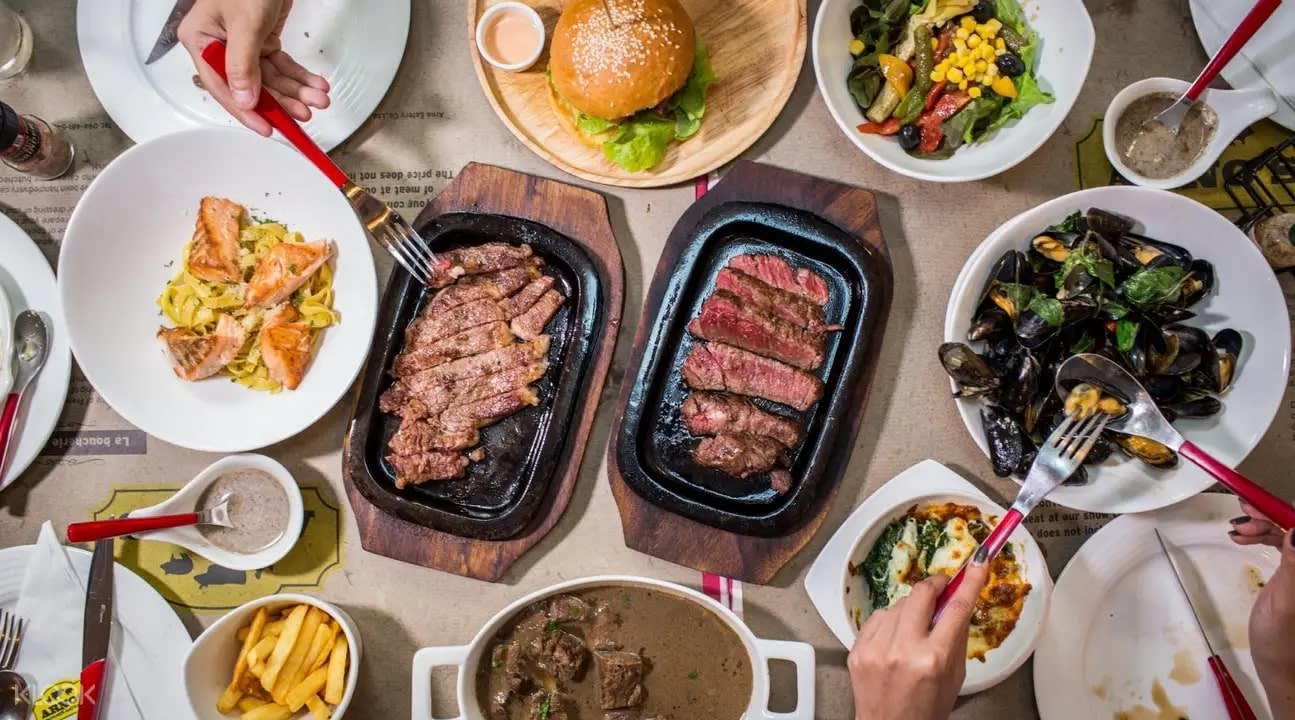 Sizzling steaks at Arno's Suanplu