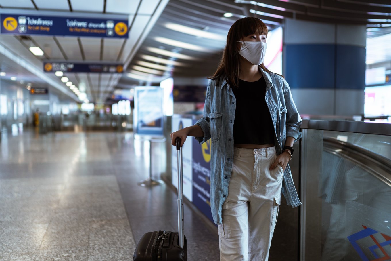 woman with face mask in airport