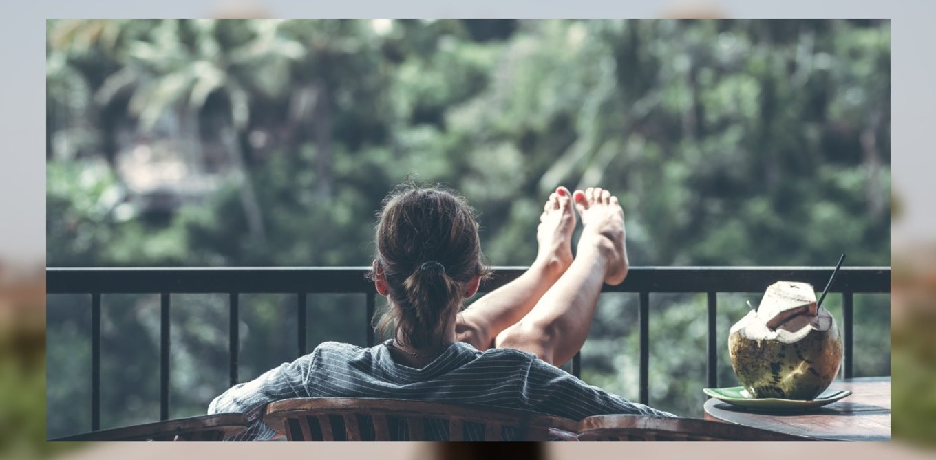 back view of girl sitting with her feet up