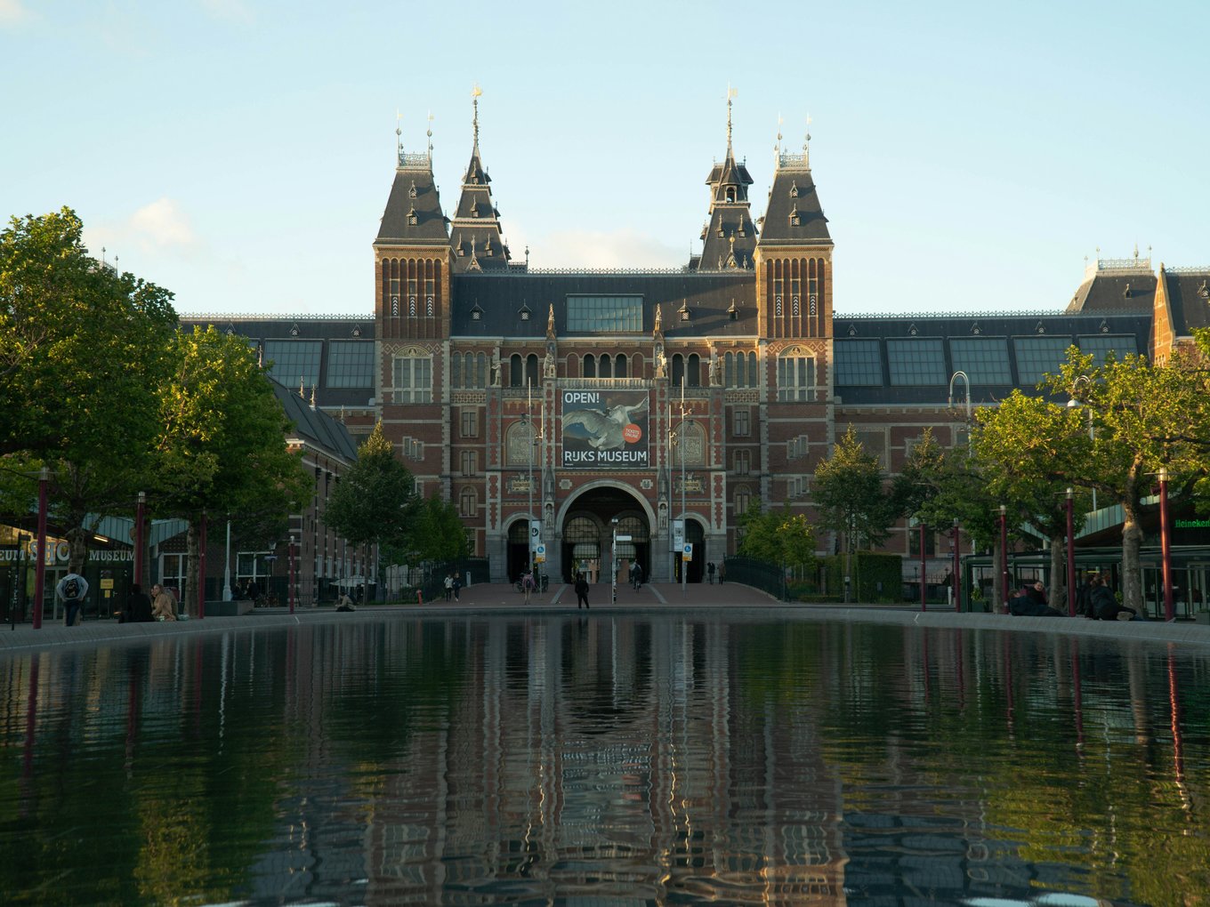 Walk along the tree-lined exterior leading to the Rijksmuseum