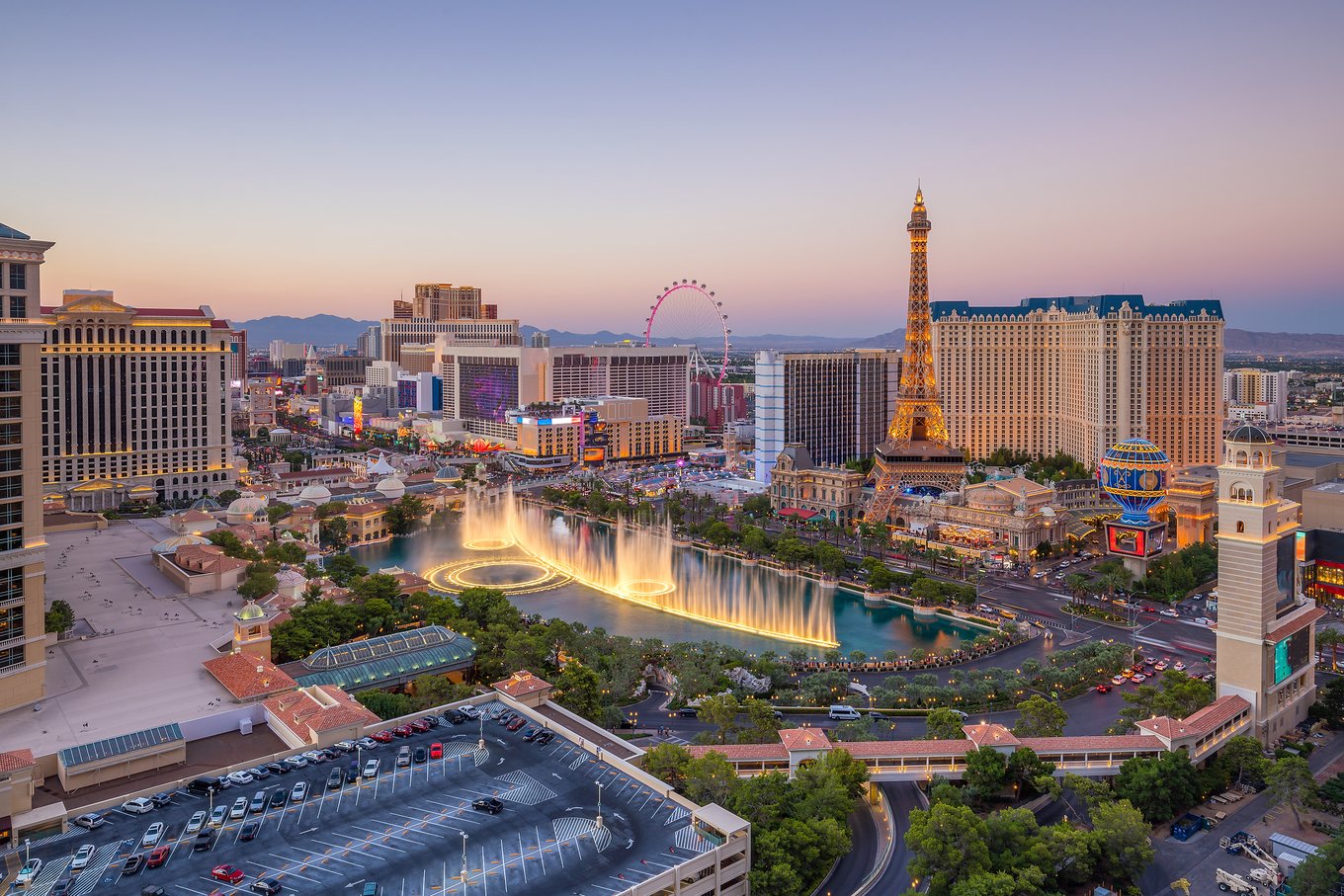 Aerial shot of Las Vegas Strip with Bellagio fountains and Eiffel Tower replica
