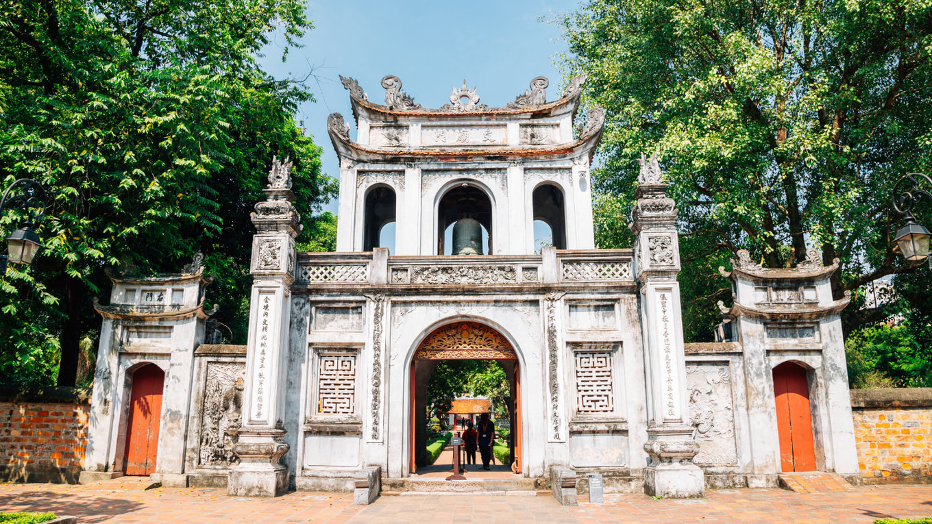 Front view of Temple of Literature entrance with trees and clear sky