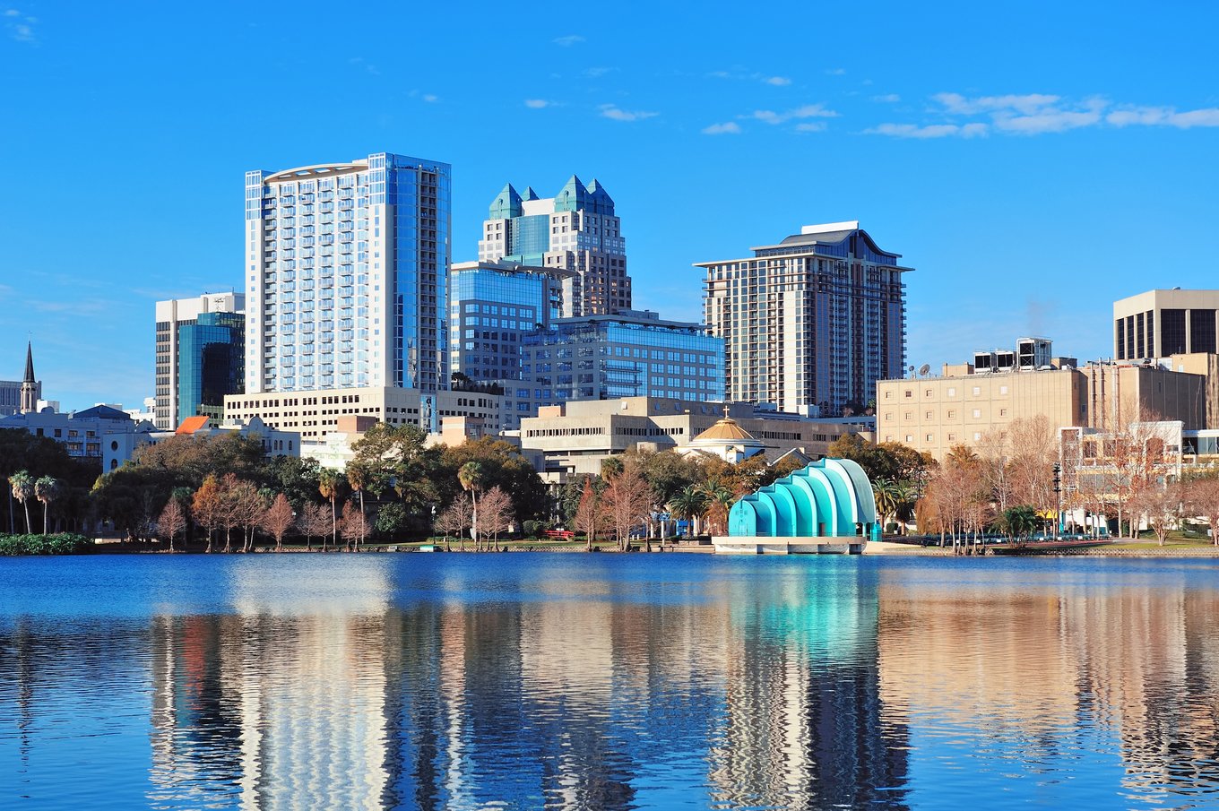 Lake Eola with Orlando city skyline and amphitheater reflected in the water