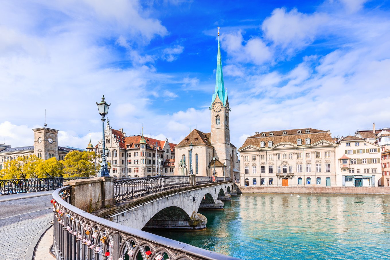Zurich cityscape with river, historic bridge, and Old Town architecture 
