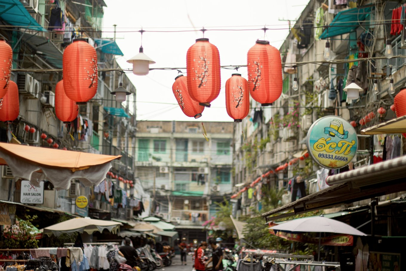 Saigon market Ho Chi Minh Chinatown street with red lanterns and shops
